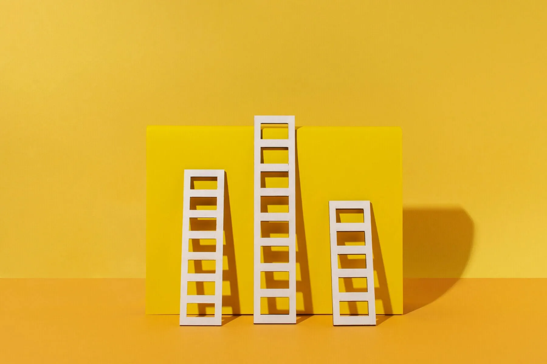 ladders-arrangement-with-yellow-background